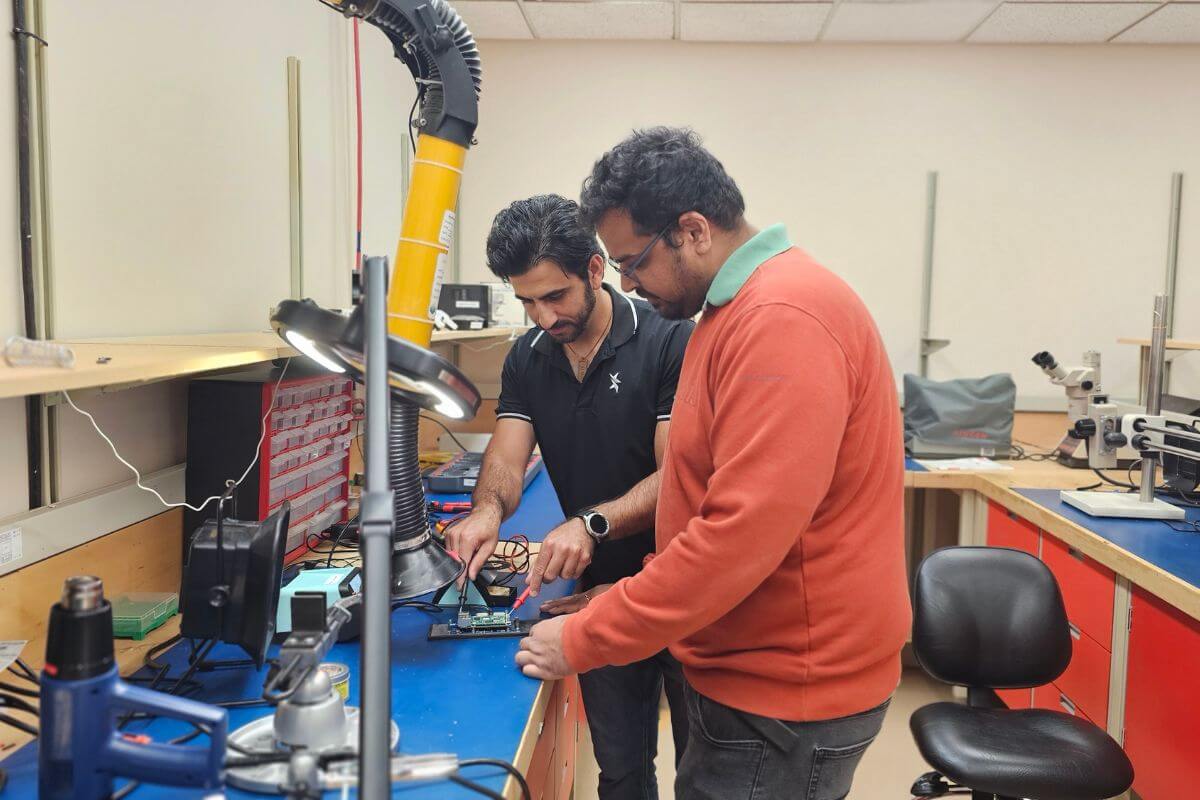 Aidin Vahidmohammadi and Rishabh Goel testing equipment at the University of Calgary's Life Sciences Innovation Hub