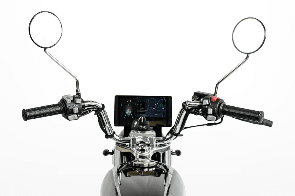 Screen display showing maps, speed, and camera views between the handlebars of a motorcycle.